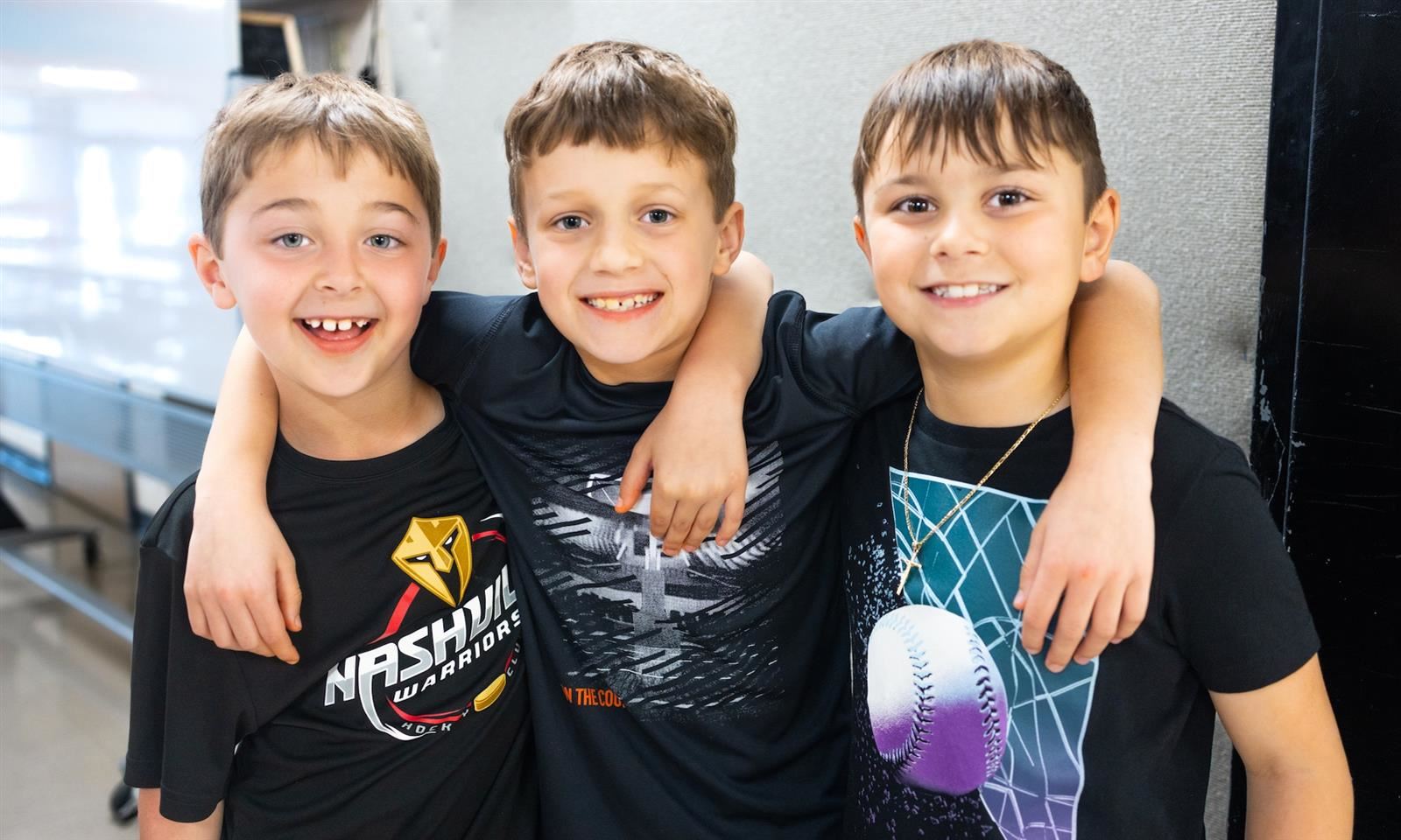  Three boys smile